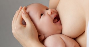 Mother breast feeding her infant