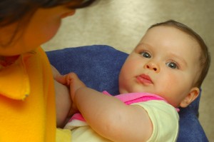 Baby Girl Distracted From Breastfeeding