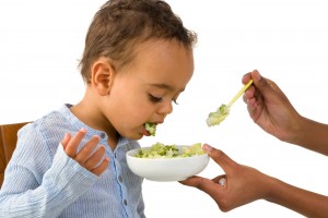 Little 18 month African toddler boy refusing to eat his vegetabl