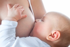 Mother is breast-feeding her baby