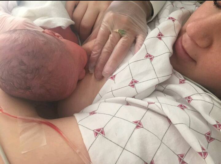 Badass Amber breastfeeding her baby